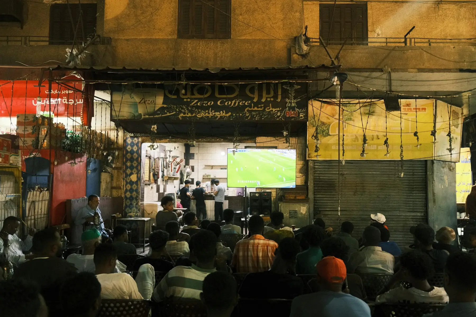 Football fans in a stadium at night